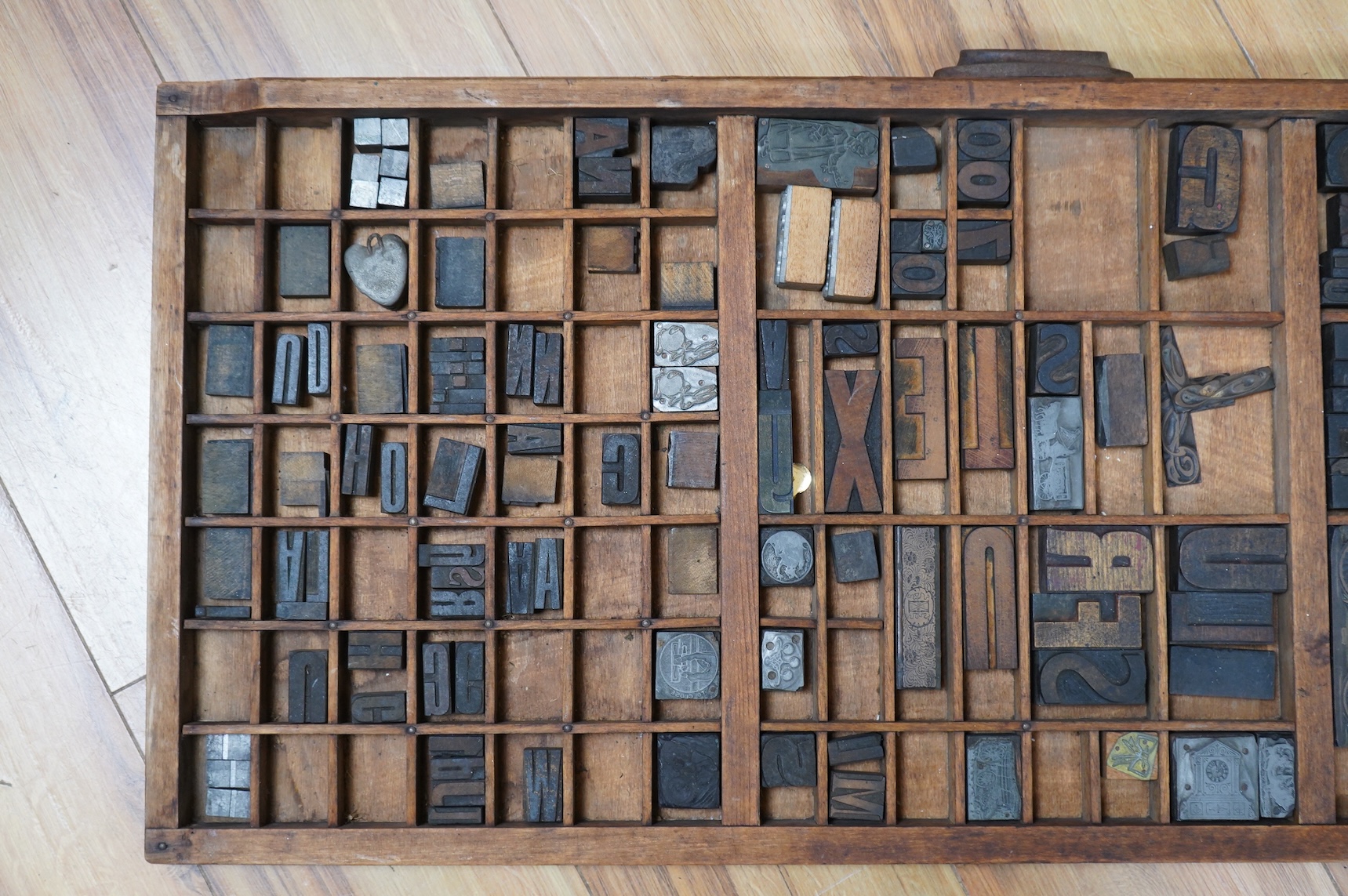 A printer's tray and various type-sets